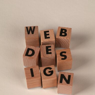 Wooden blocks arranged to spell 'Web Design'. Perfect for creative, digital content themes.